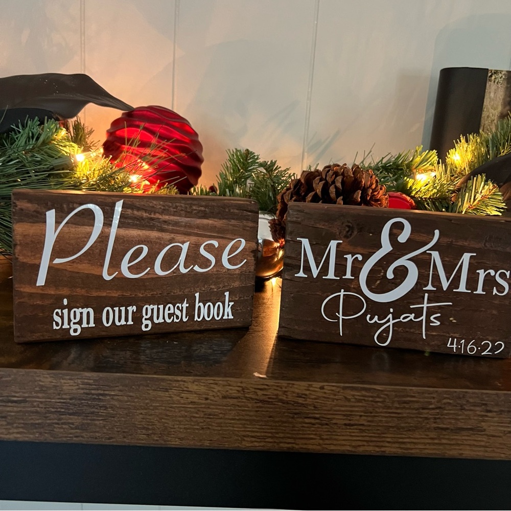 Wedding guest book and couple signs